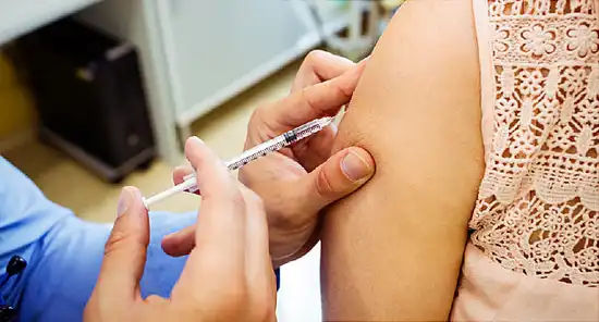 woman receiving vaccination