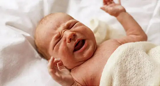 Closeup of newborn baby crying