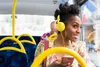 photo of woman on bus listening to musicphoto of woman on bus listening to music