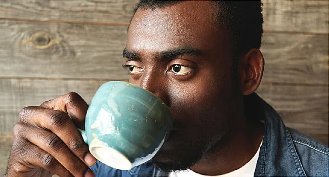 young man drinking coffee
