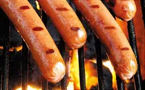 hot dogs on the grill