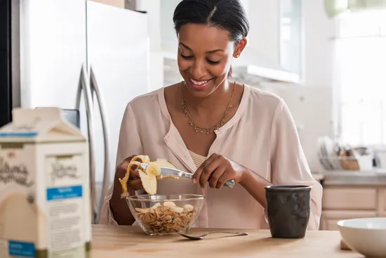photo of woman eating breakfast