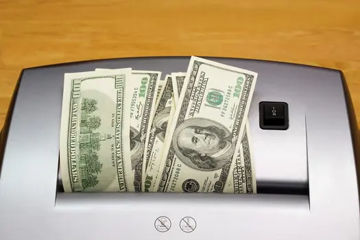photo of money in shredder