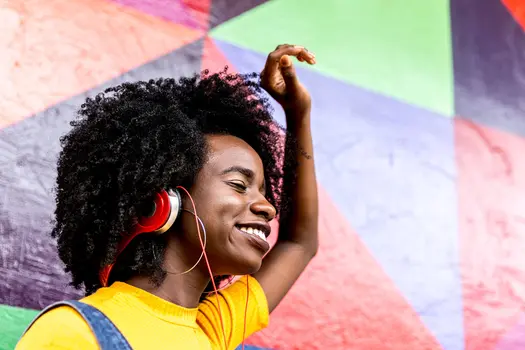 photo of woman listening to music