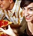 Woman eating pizza 