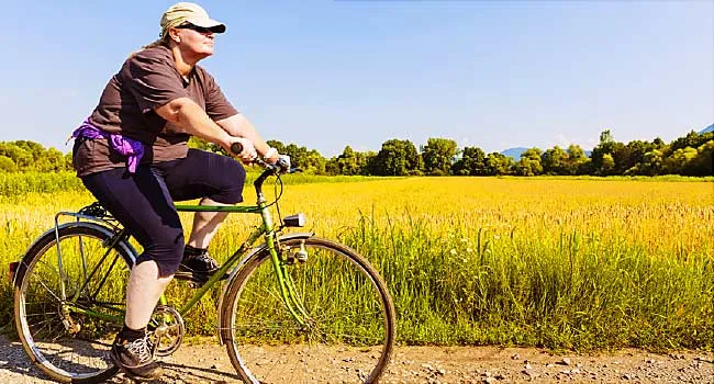 overweight woman riding bicycle