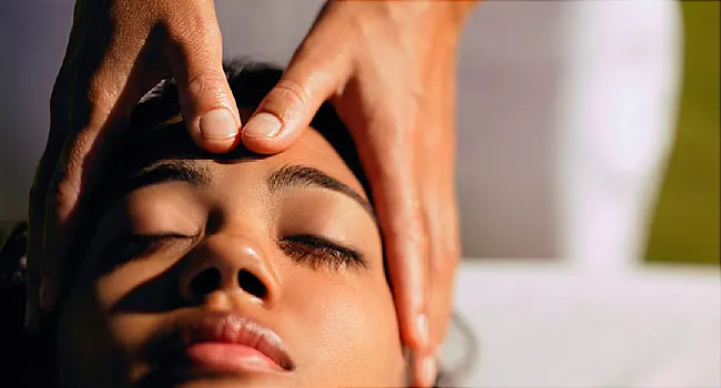 photo of woman getting head massage