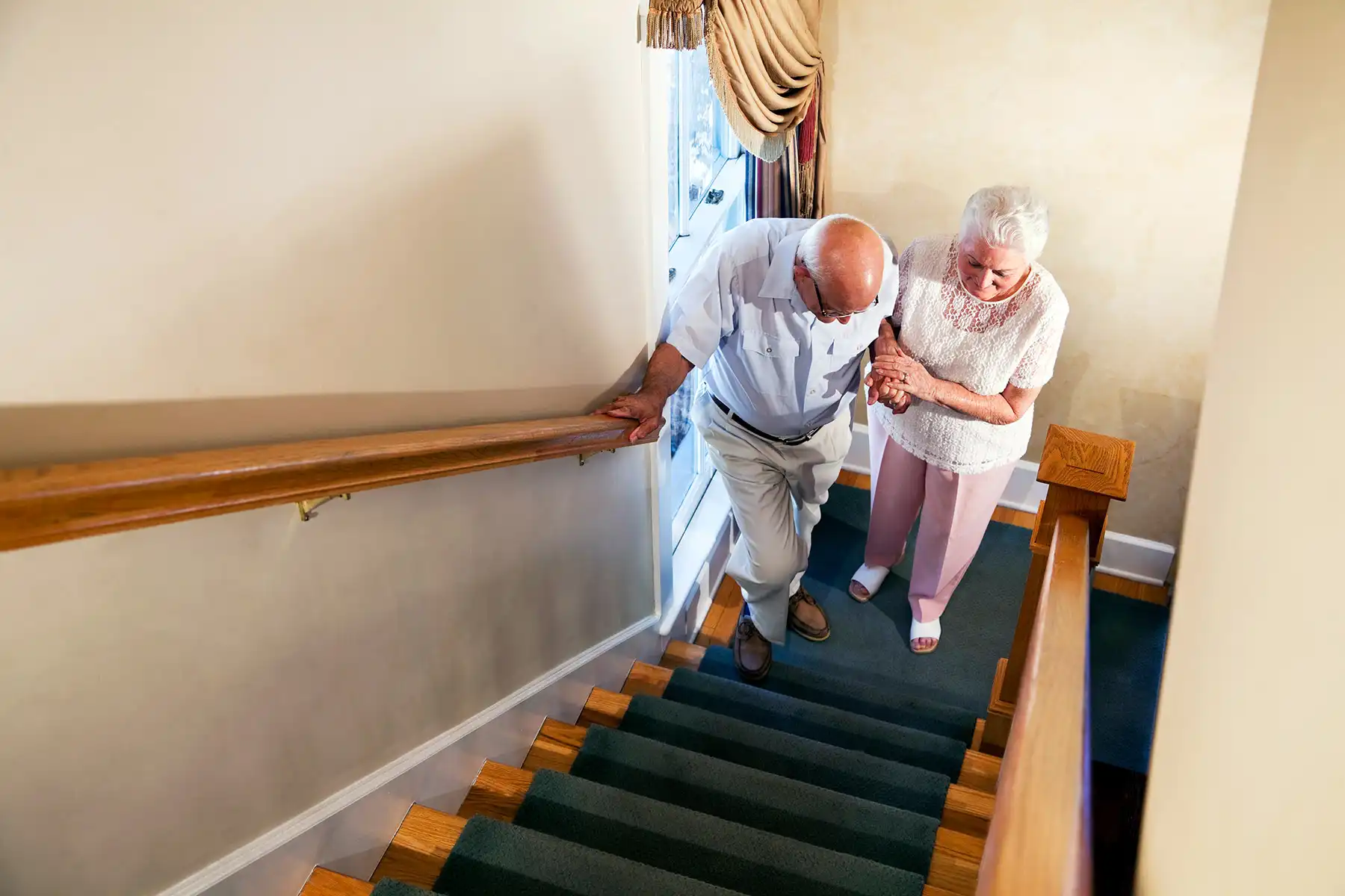 photo of senior couple climbing stairs