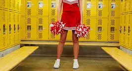 female cheerleader in locker room