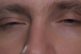 close up man sleepy eyes