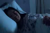 photo of woman sleeping in bed