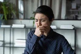 photo of sick female coughing