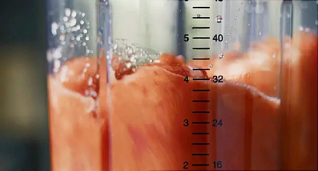 making fruit smoothie in blender close up