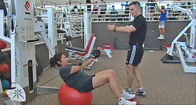 woman and trainer in gym