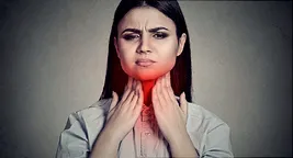 woman with throat pain
