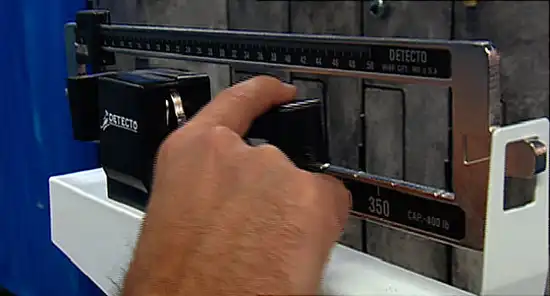 hand moving weight scale