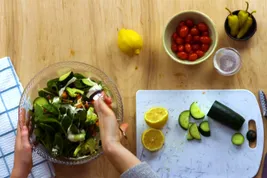 photo of person making salad
