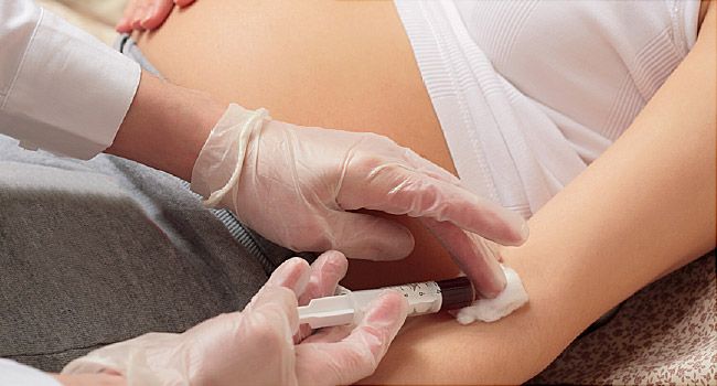 pregnant woman getting blood taken