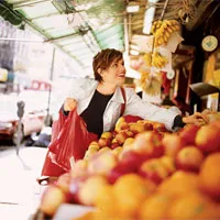 Womenshealth Woman Choosing Oranges