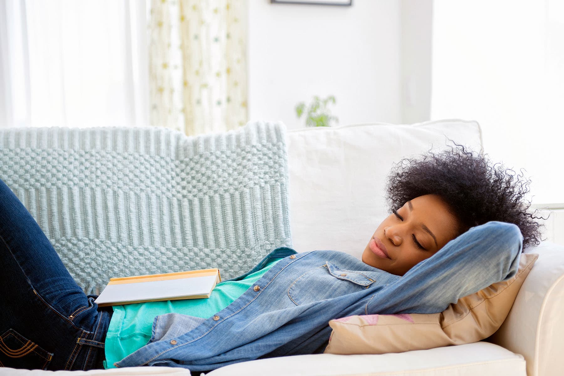 photo of woman napping on sofa