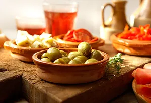 small plates of olives and cheese