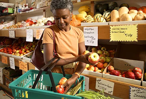 Mature woman shopping organic produce