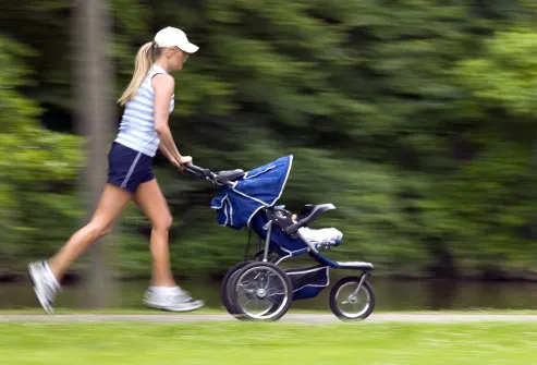woman jogging with stroller