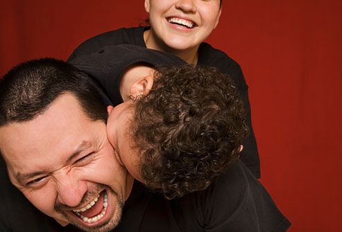 Father laughing with son