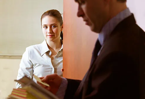 Woman admiring well-suited businessman 