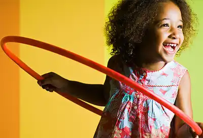 Young girl with hula hoop