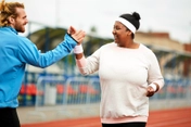 photo of woman highfiving her trainer