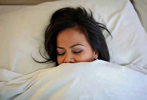 woman sleeping in bed