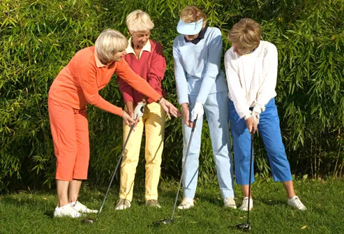 Women taking golf lessons