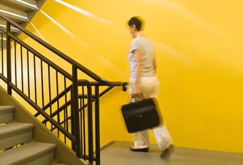 Woman walking down stairwell