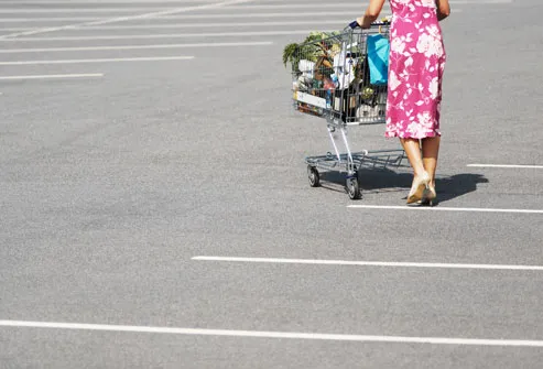 Woman walking across parking lot
