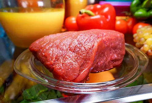 raw meat on refrigerator shelf