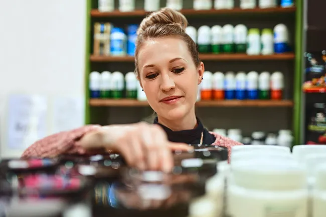 woman looking at supplements