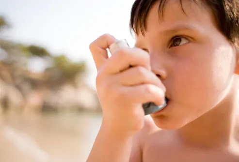 Boy Using Asthma Inhaler