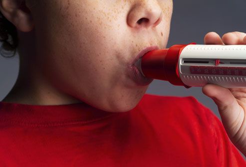 Boy Blowing Into Spirometer