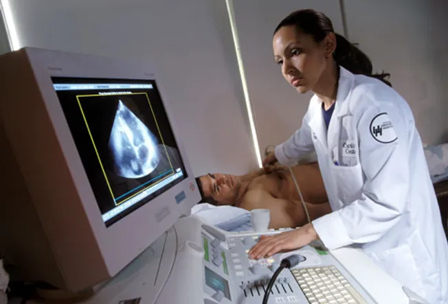 Doctor Performing Echocardiograph