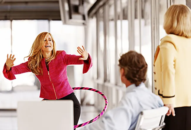 office worker using hula hoop