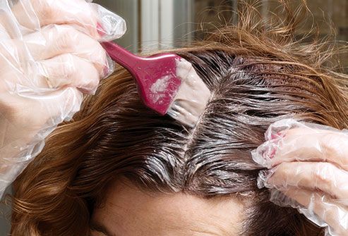 woman arranging hair