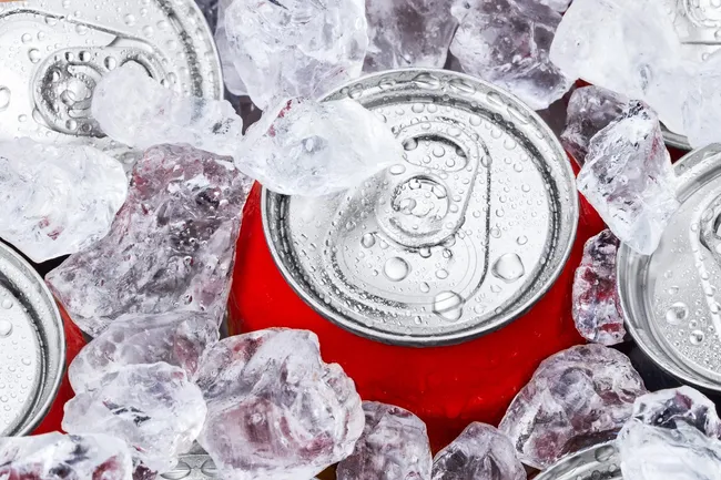 photo of cans of soda on ice