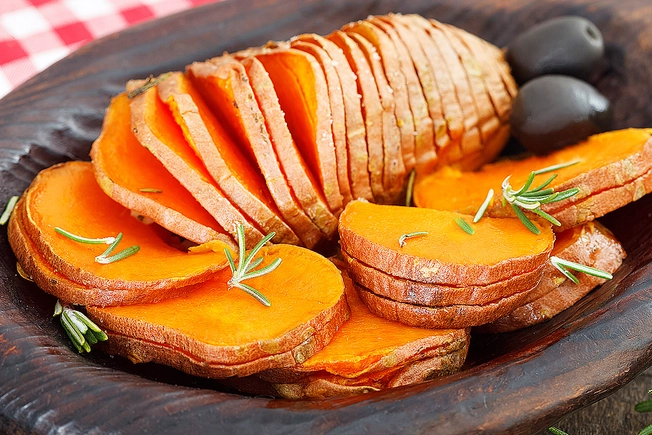 https://img.webmd.com/dtmcms/live/webmd/consumer_assets/site_images/articles/health_tools/best_and_worst_foods_for_ulcers_slideshow/1800ss_thinkstock_rf_sliced_baked_sweet_potato_in_bowl.jpg?resize=652px:*&output-quality=100