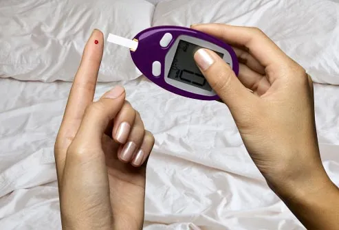 diabetes test kit with bed in background
