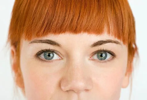 woman with blue eyes and red hair