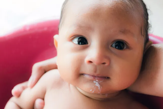 milk on babys face