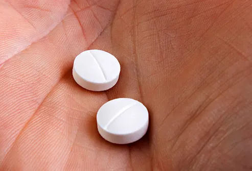 aspirin in hand close up