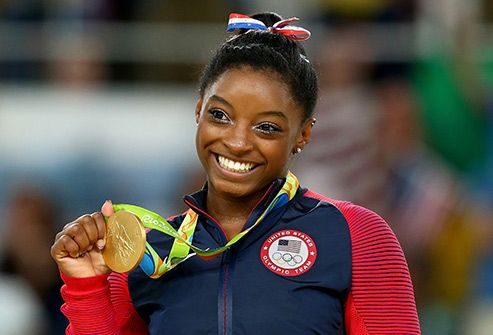 simone biles with gold medal