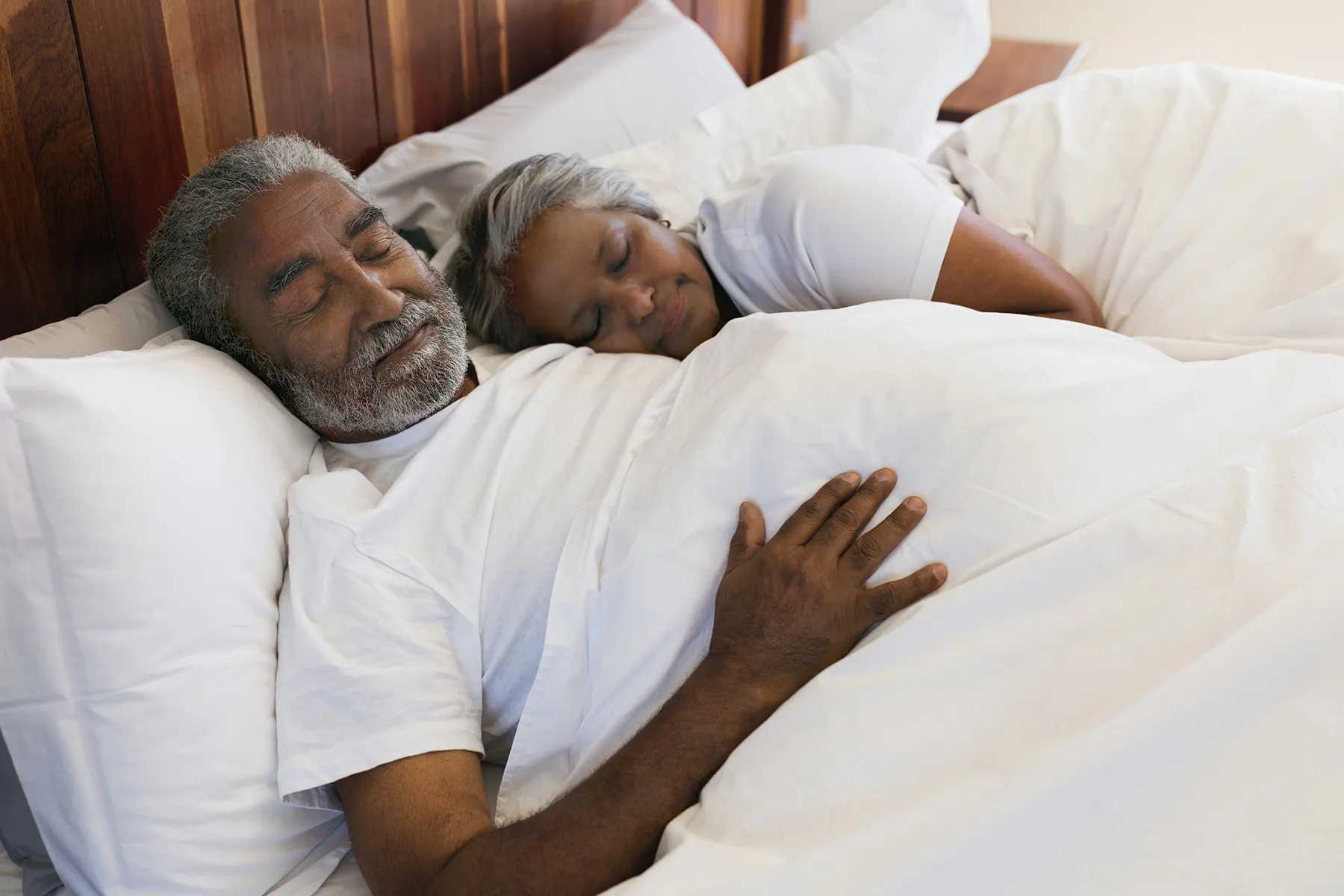 photo of senior couple sleeping